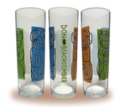 A Zombie glass with three cannibal figures colored orange, green, and blue next to “Don the Beachcomber” written on the side.