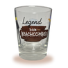 A Mai Tai glass with a silhouette bust of Donn Beach on one side and The Legend Returns written above the Don the Beachcomber logo with tiki torches on the other side.