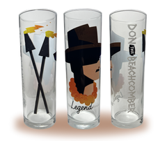 A Zombie glass with a silhouette bust of Donn Beach with “The Legend Returns” written below. “Don the Beachcomber” written on the side and tiki torches on the other side.